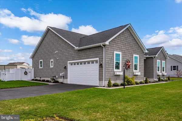 a aerial view of a house with a yard