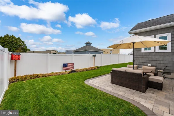 a view of a lake with boats and trees in the background
