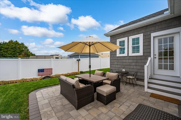 a view of a swimming pool with a yard