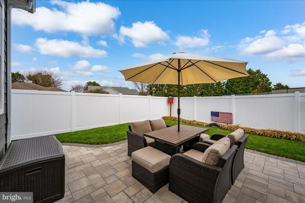 a view of a backyard with plants and a garden