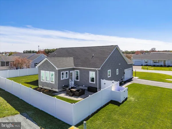 an aerial view of a house with a ocean view