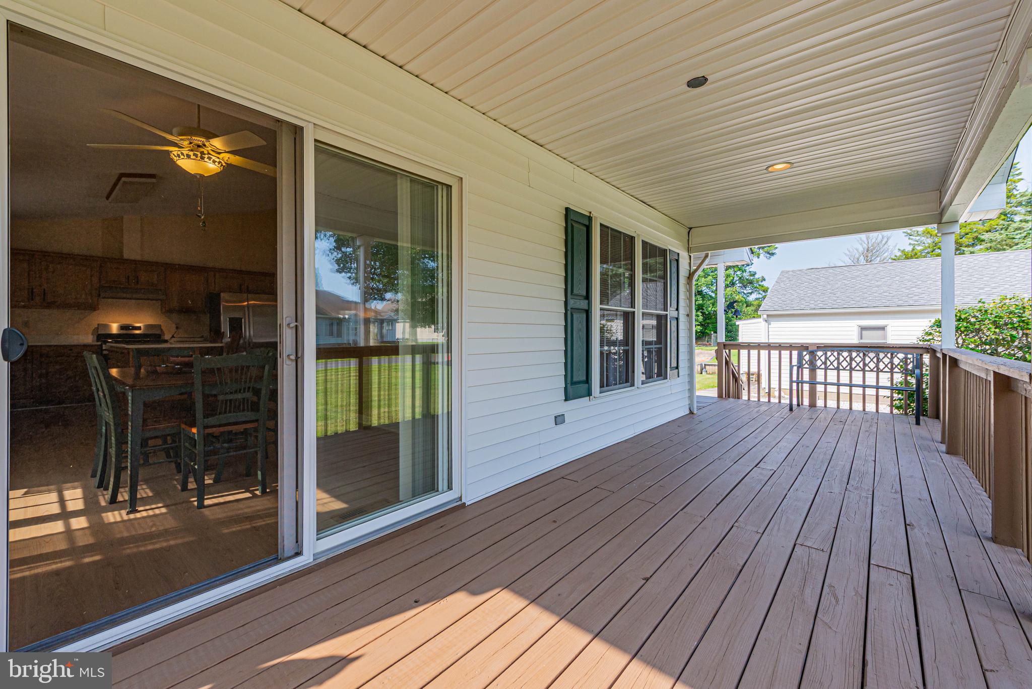 32408 Holly Ter Road Ocean View, DE 19970 - Photo 15 of 51 a view of a house with porch and wooden floor
