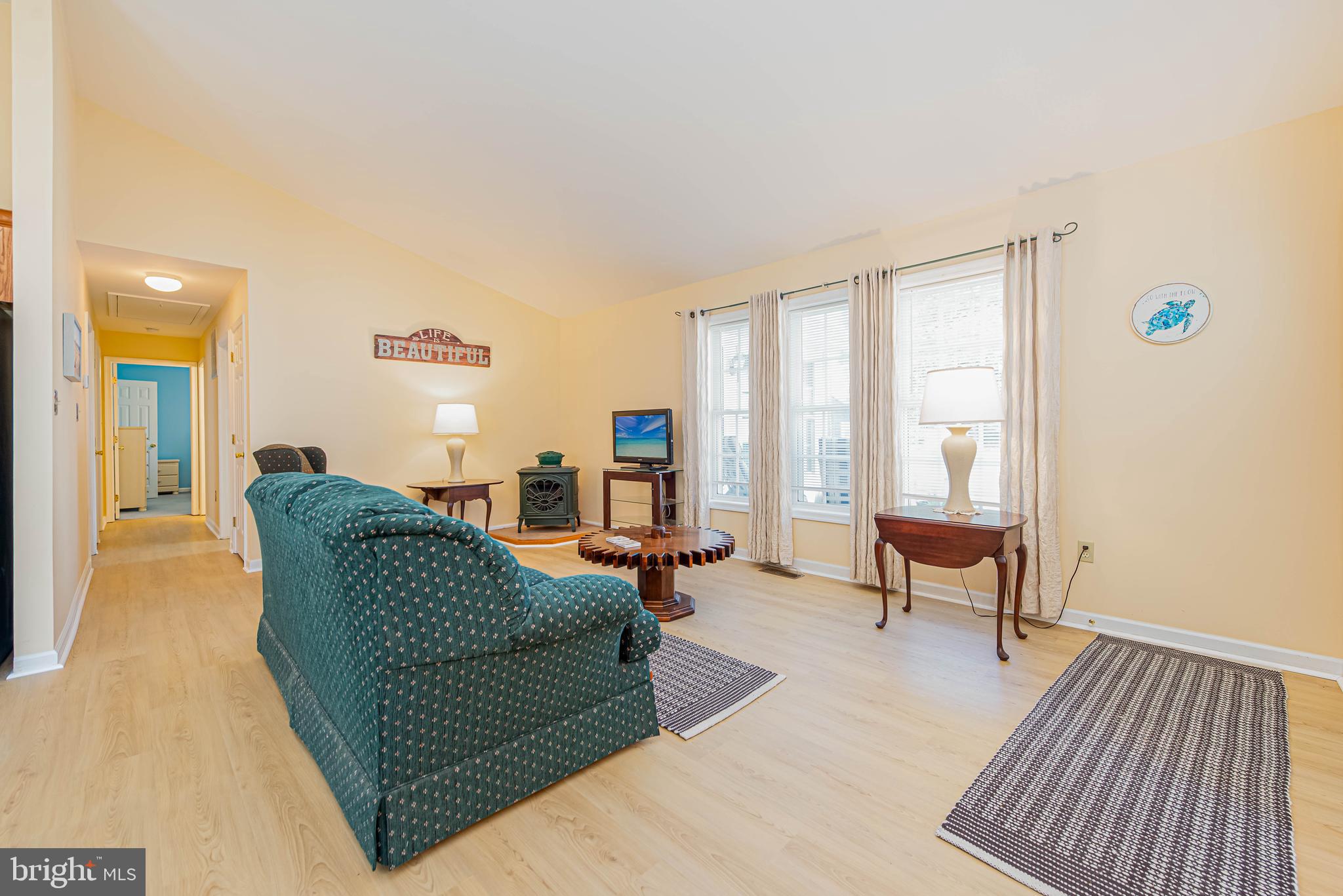 32408 Holly Ter Road Ocean View, DE 19970 - Photo 16 of 51 a living room with furniture and a wooden floor