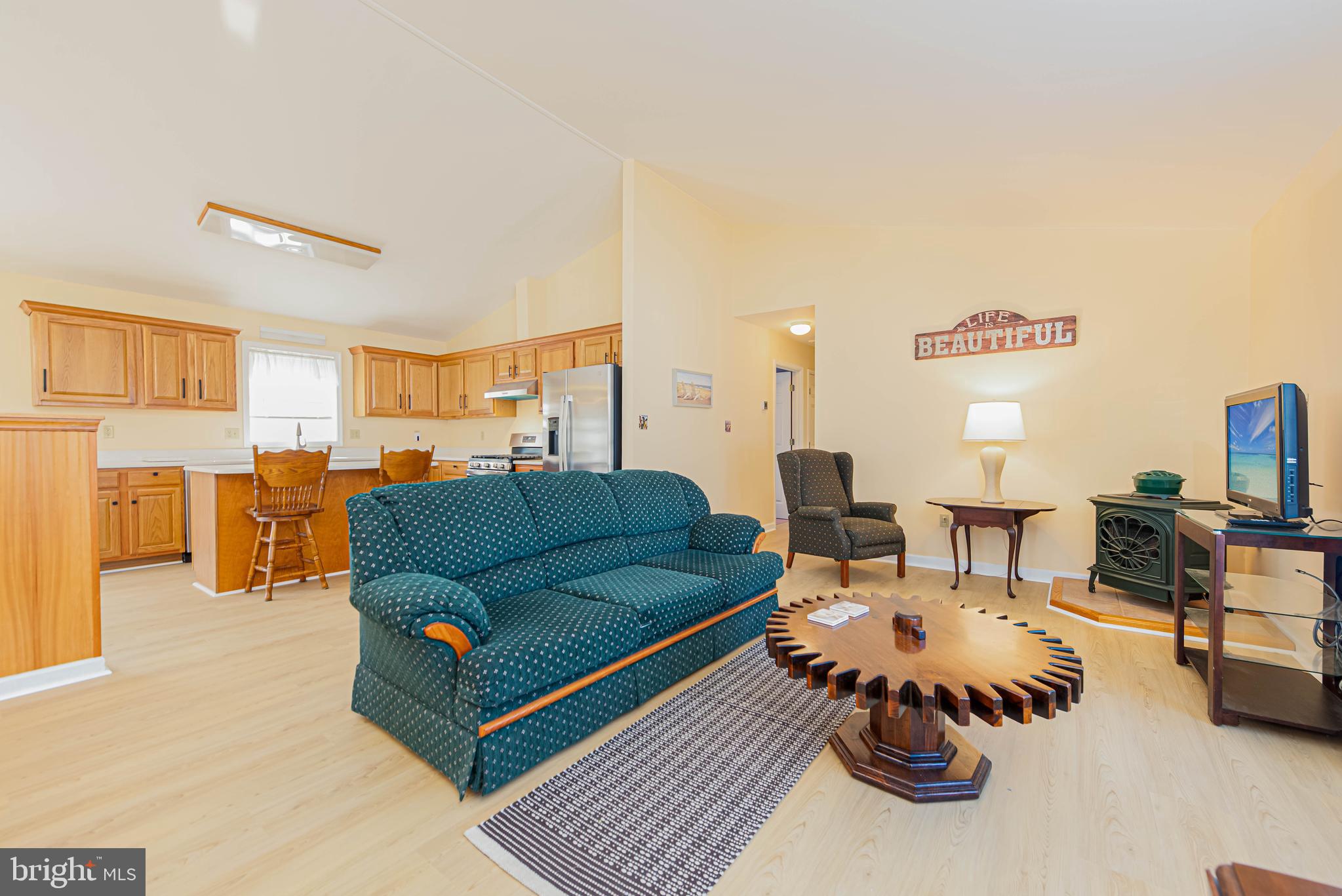 32408 Holly Ter Road Ocean View, DE 19970 - Photo 17 of 51 a living room with furniture and a view of kitchen