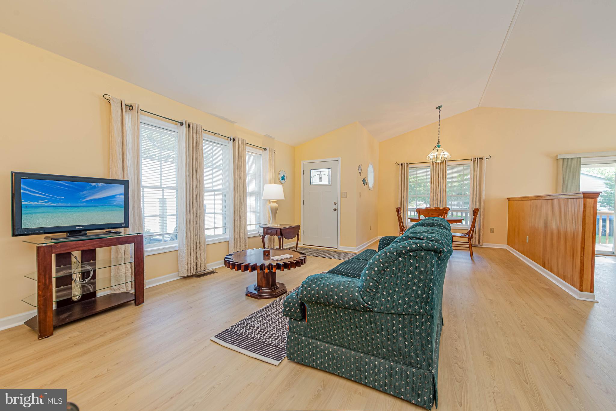 32408 Holly Ter Road Ocean View, DE 19970 - Photo 19 of 51 a living room with furniture and a flat screen tv
