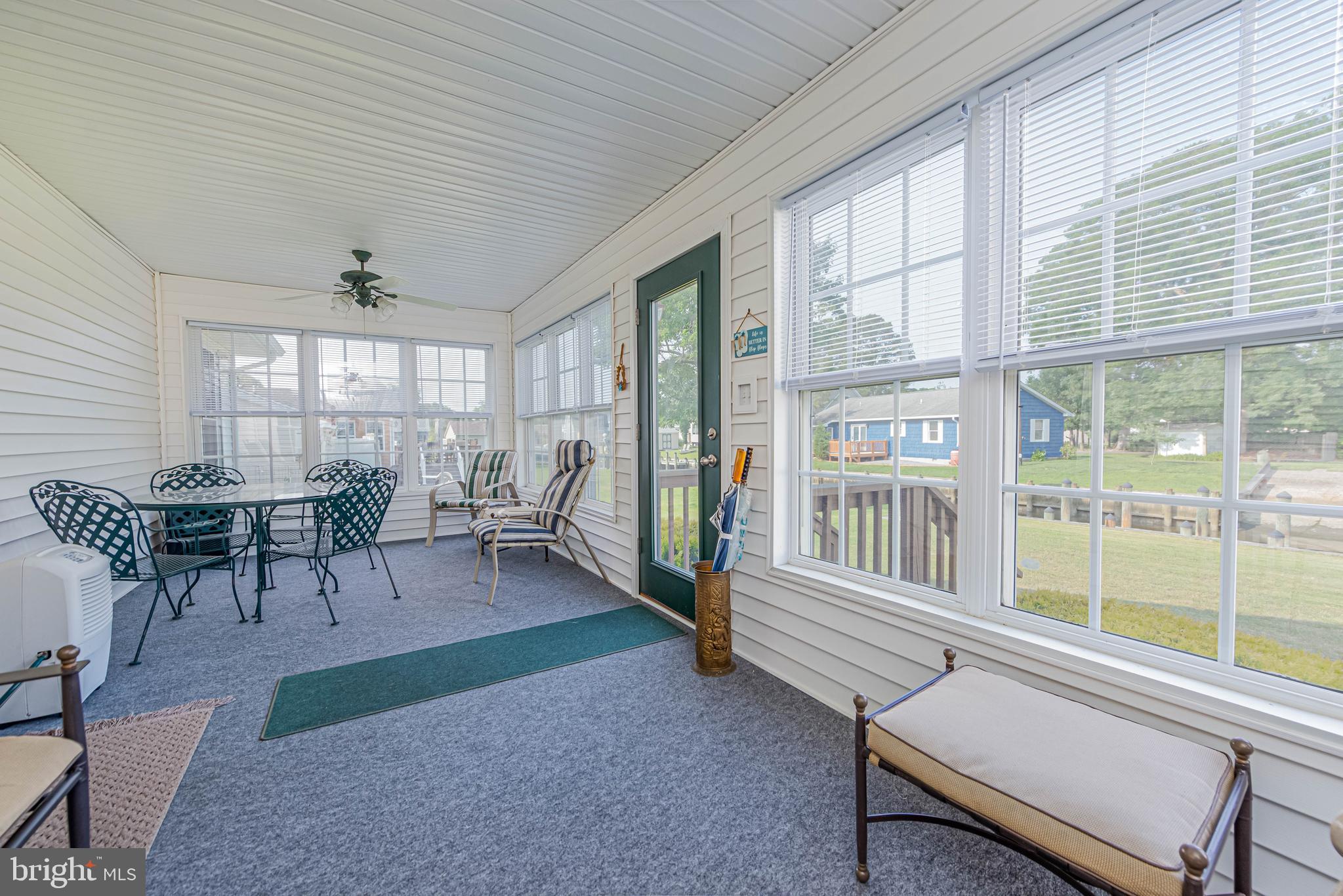 32408 Holly Ter Road Ocean View, DE 19970 - Photo 26 of 51 a living room with furniture and a large window