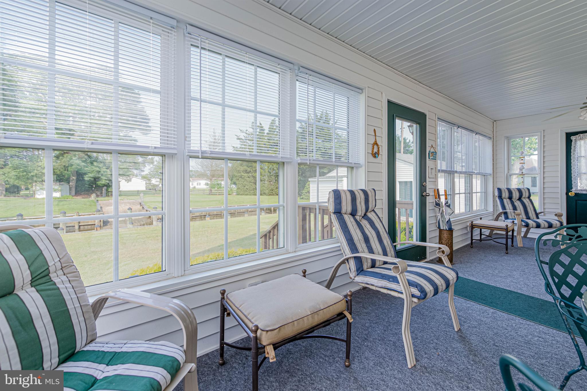 32408 Holly Ter Road Ocean View, DE 19970 - Photo 28 of 51 a living room with furniture and a large window