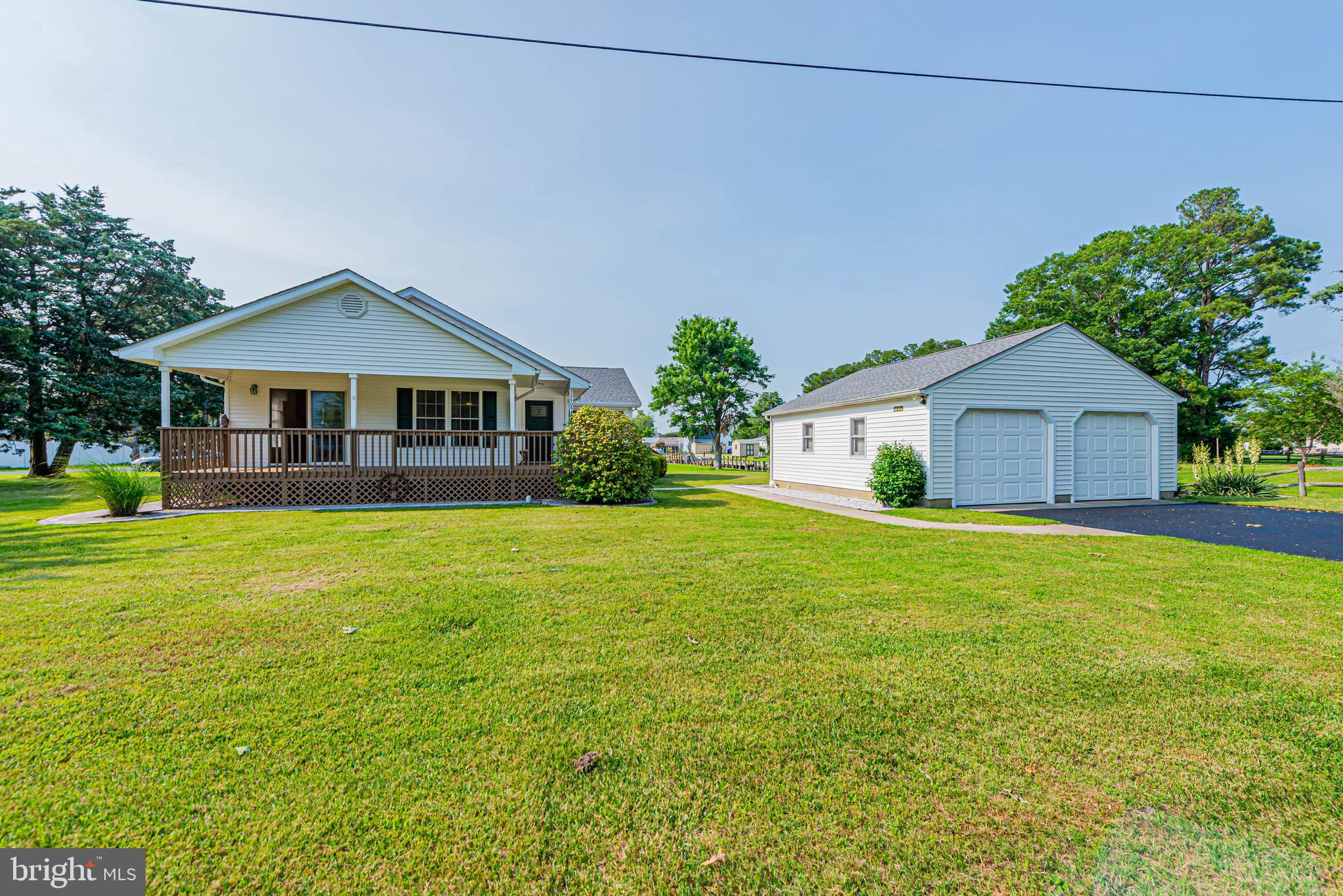 32408 Holly Ter Road Ocean View, DE 19970 - Photo 3 of 51 a front view of a house with garden