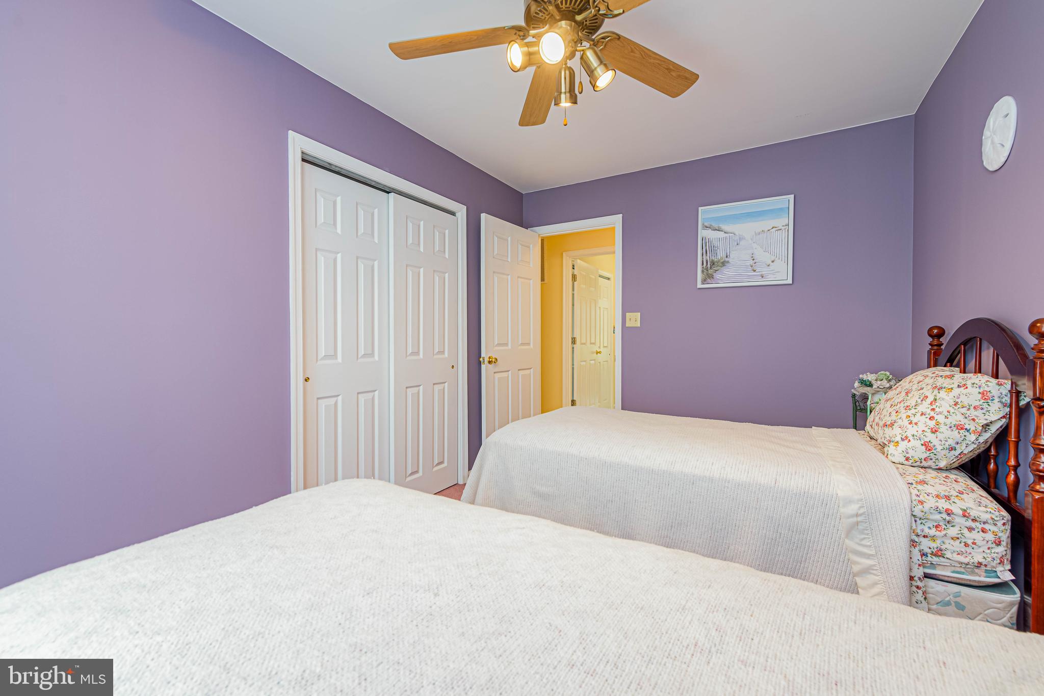 32408 Holly Ter Road Ocean View, DE 19970 - Photo 31 of 51 a bedroom with a bed and chandelier