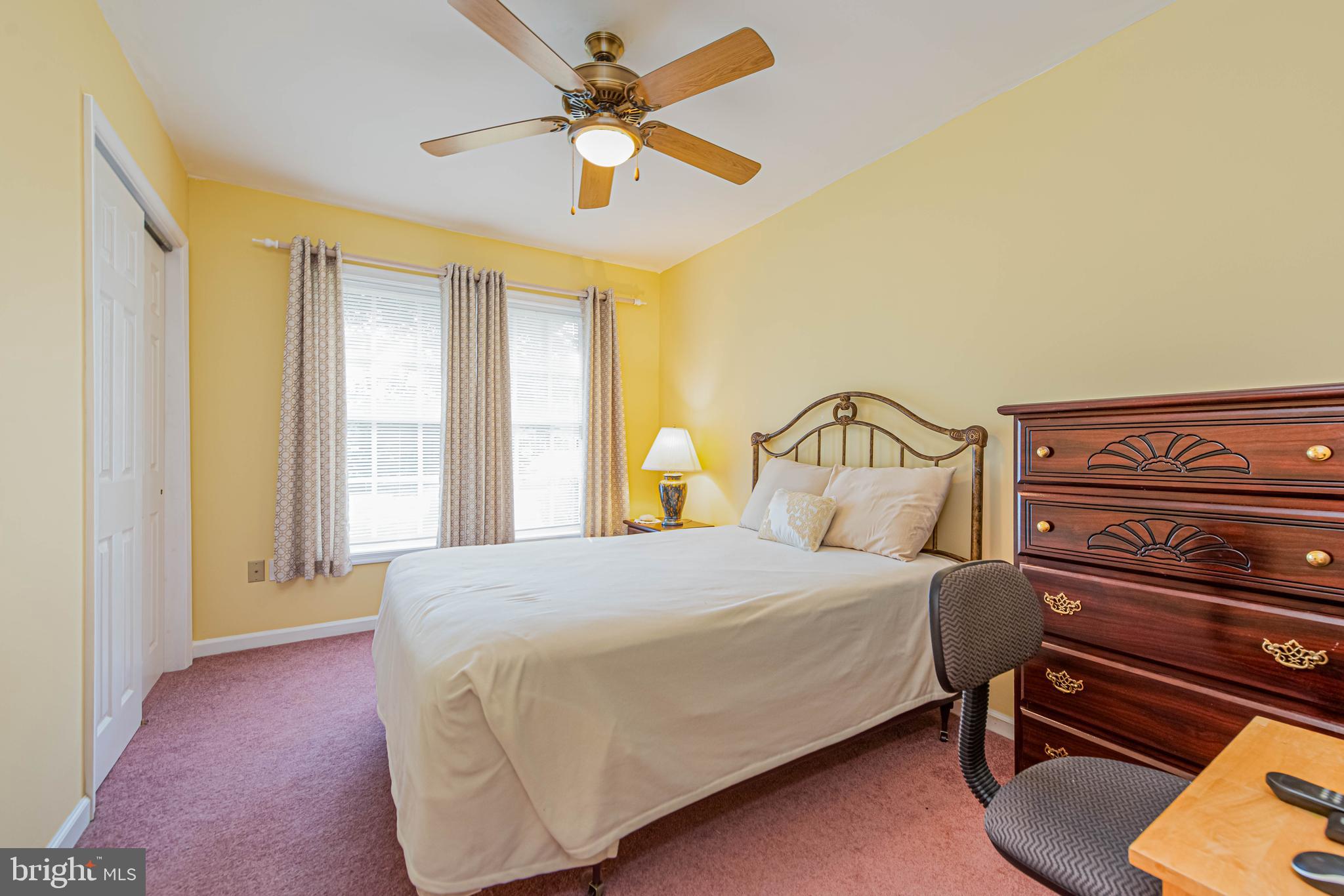 32408 Holly Ter Road Ocean View, DE 19970 - Photo 32 of 51 a bedroom with a bed dresser and a window