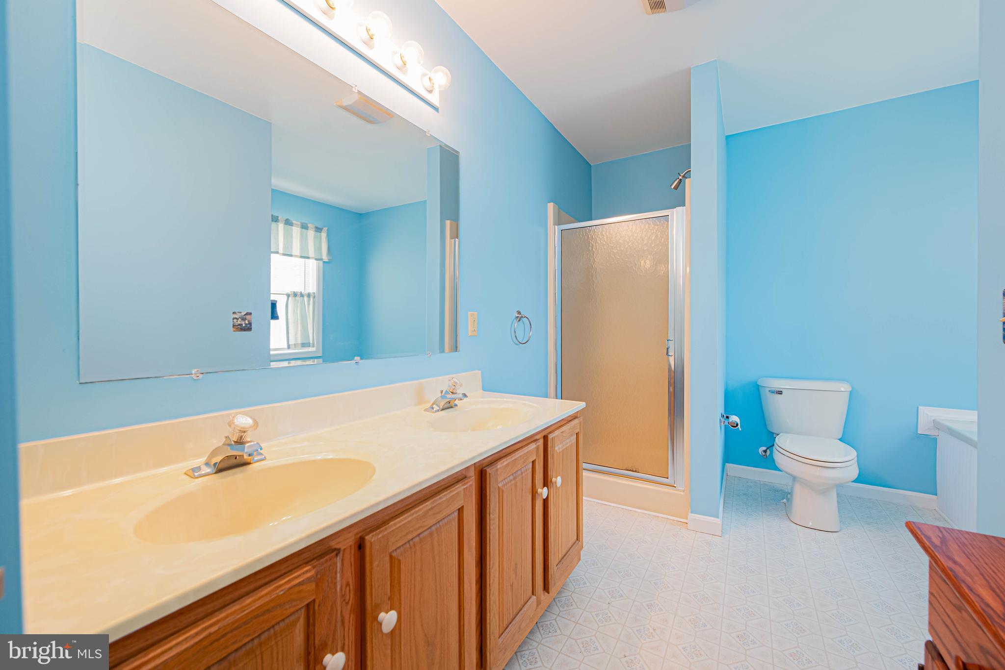 32408 Holly Ter Road Ocean View, DE 19970 - Photo 39 of 51 a bathroom with a sink and a mirror
