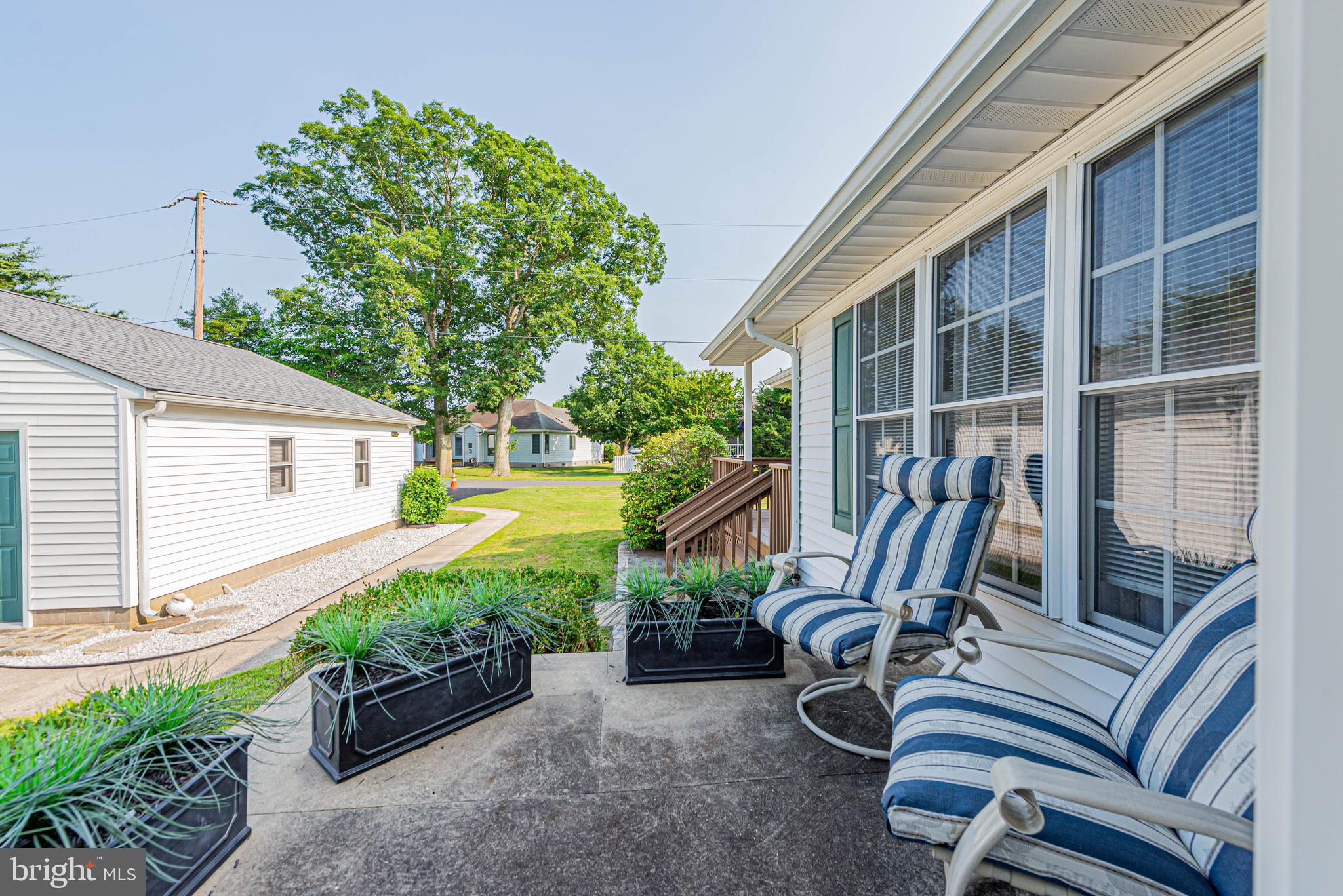 32408 Holly Ter Road Ocean View, DE 19970 - Photo 41 of 51 a view of an chairs and table in the patio