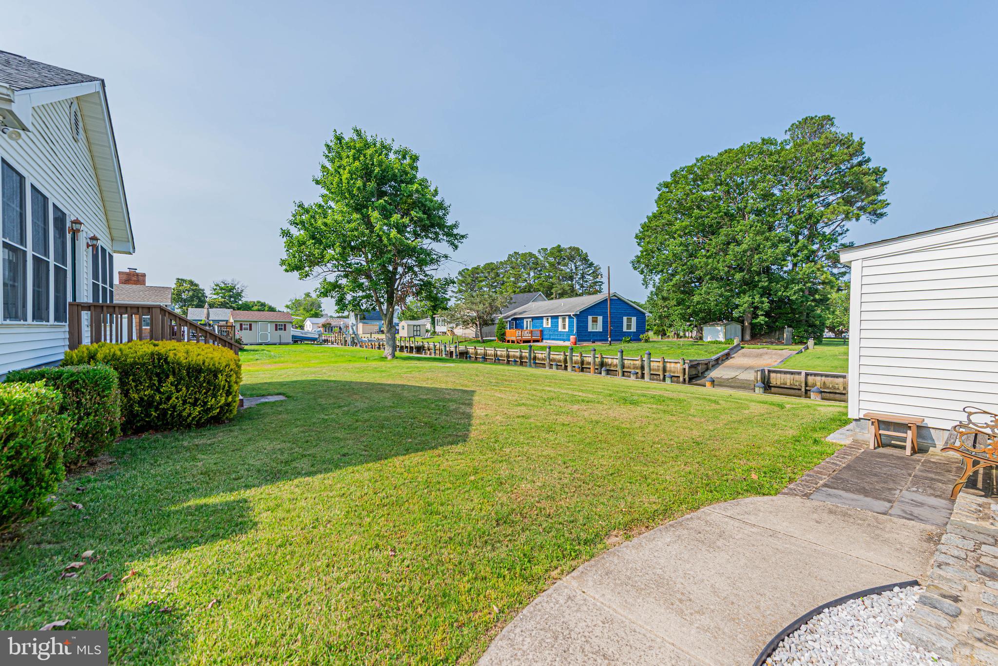 32408 Holly Ter Road Ocean View, DE 19970 - Photo 6 of 51 a view of a house with a big yard potted plants and large tree