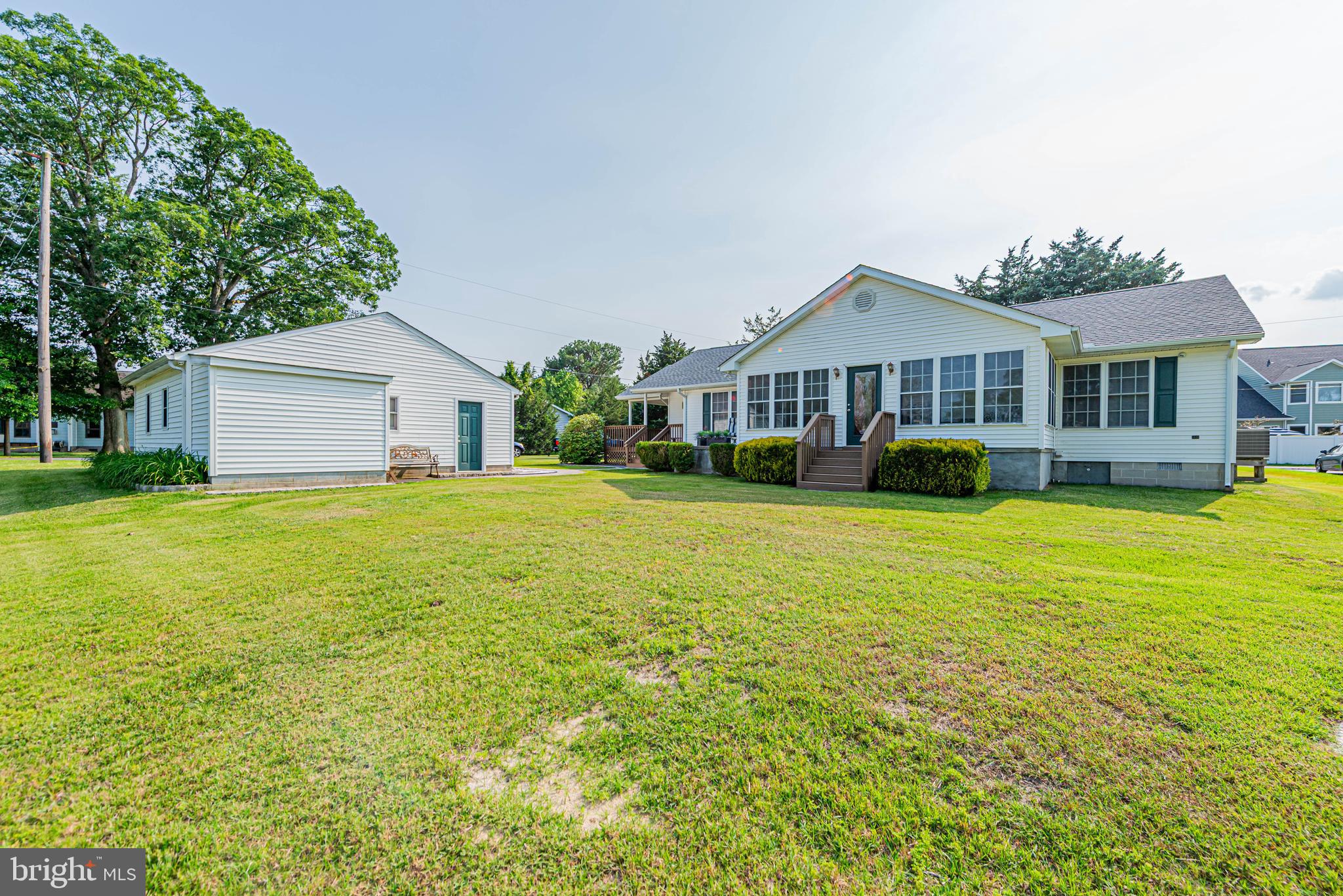 32408 Holly Ter Road Ocean View, DE 19970 - Photo 8 of 51 a front view of house with yard and green space