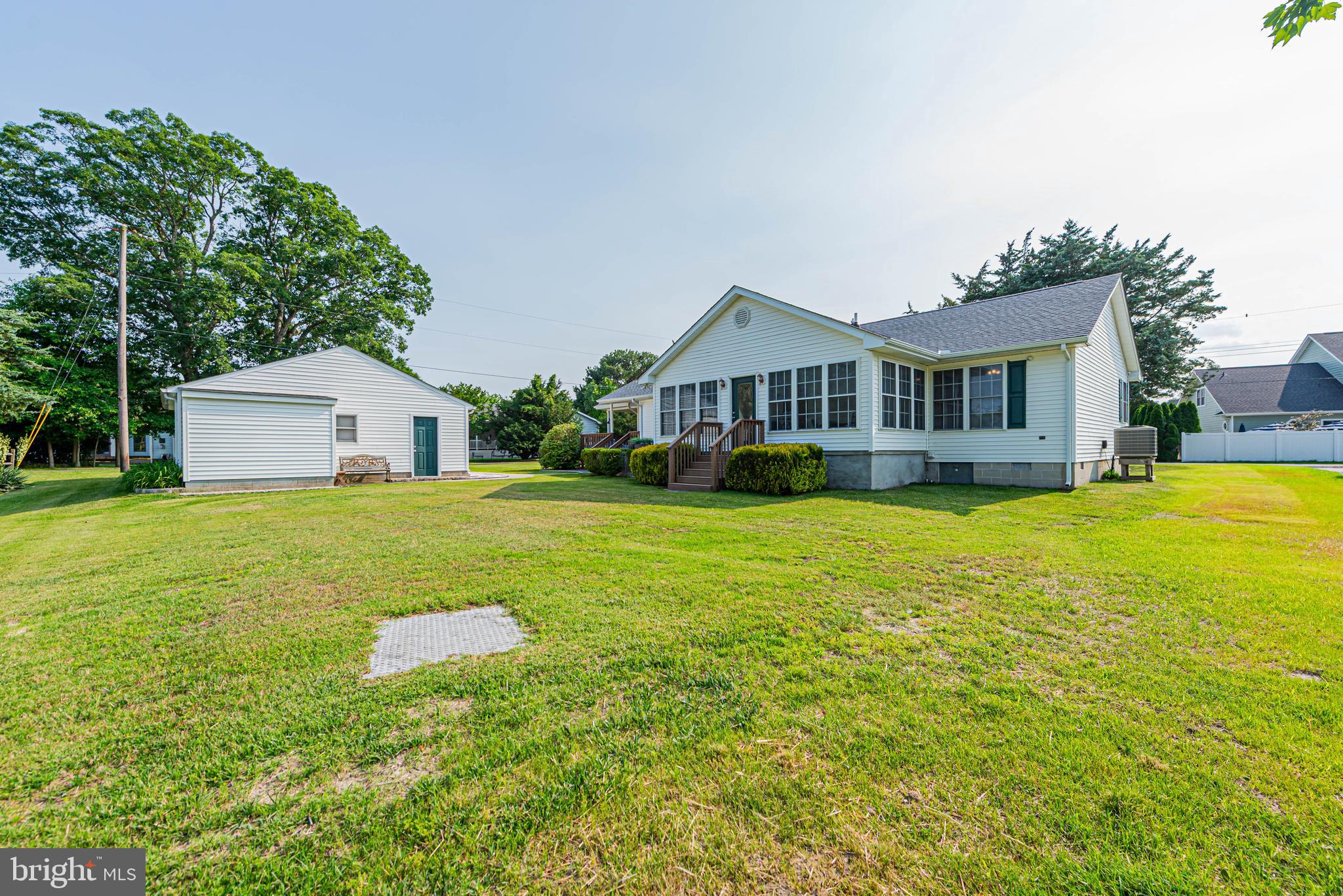 32408 Holly Ter Road Ocean View, DE 19970 - Photo 10 of 51 a front view of house with yard and swimming pool