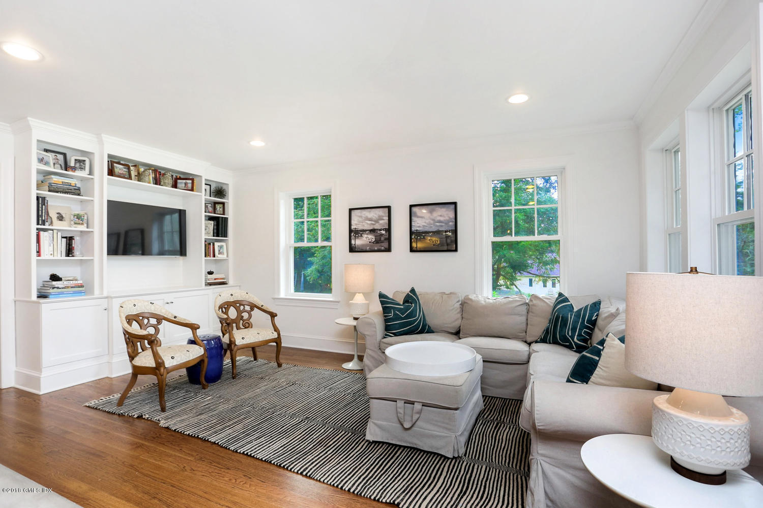 167 Riverbank Road Stamford, CT 06903 - Photo 11 of 38 a living room with furniture or couch and a flat screen tv