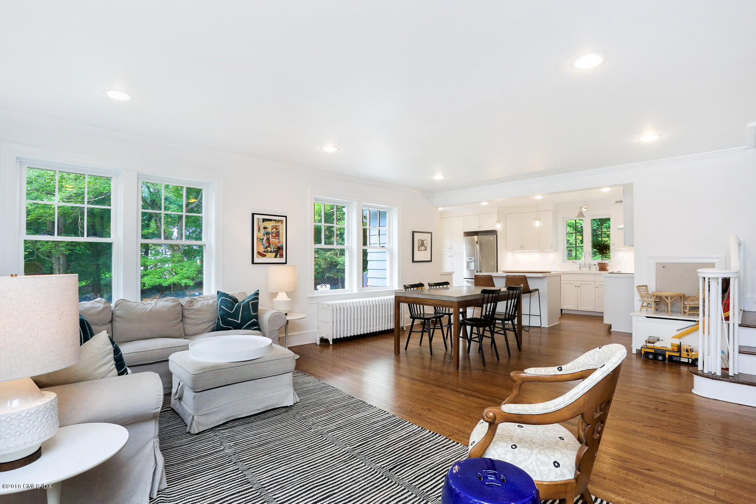 167 Riverbank Road Stamford, CT 06903 - Photo 12 of 38 a living room with furniture and a wooden floor