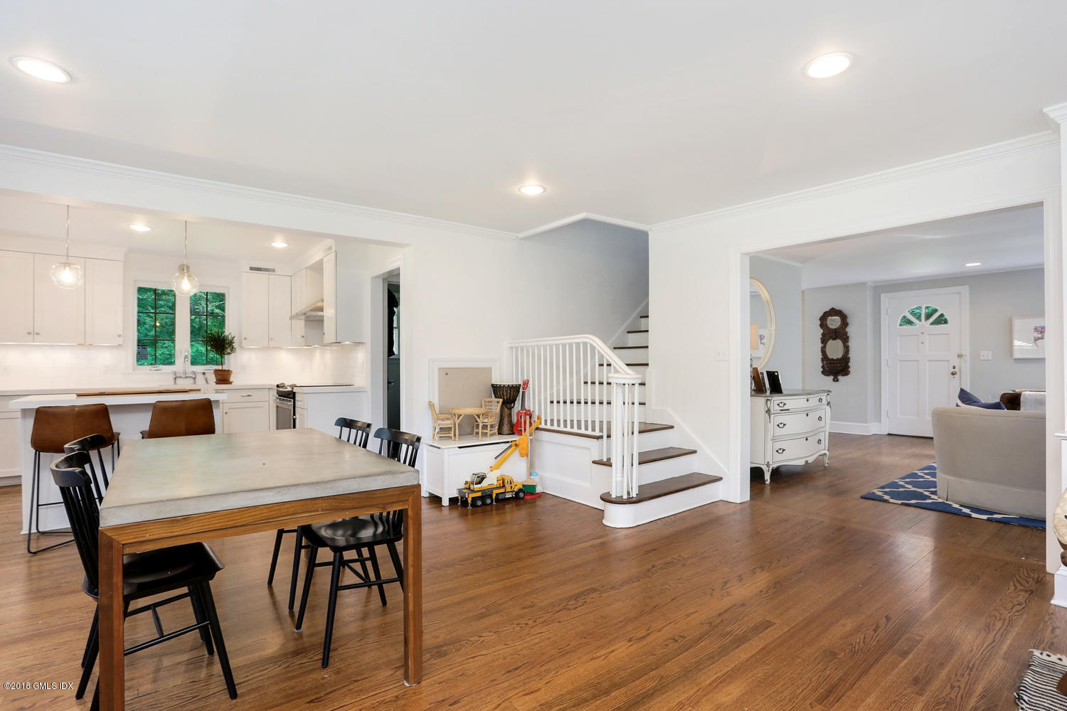 167 Riverbank Road Stamford, CT 06903 - Photo 13 of 38 a view of a dining room with furniture and wooden floor