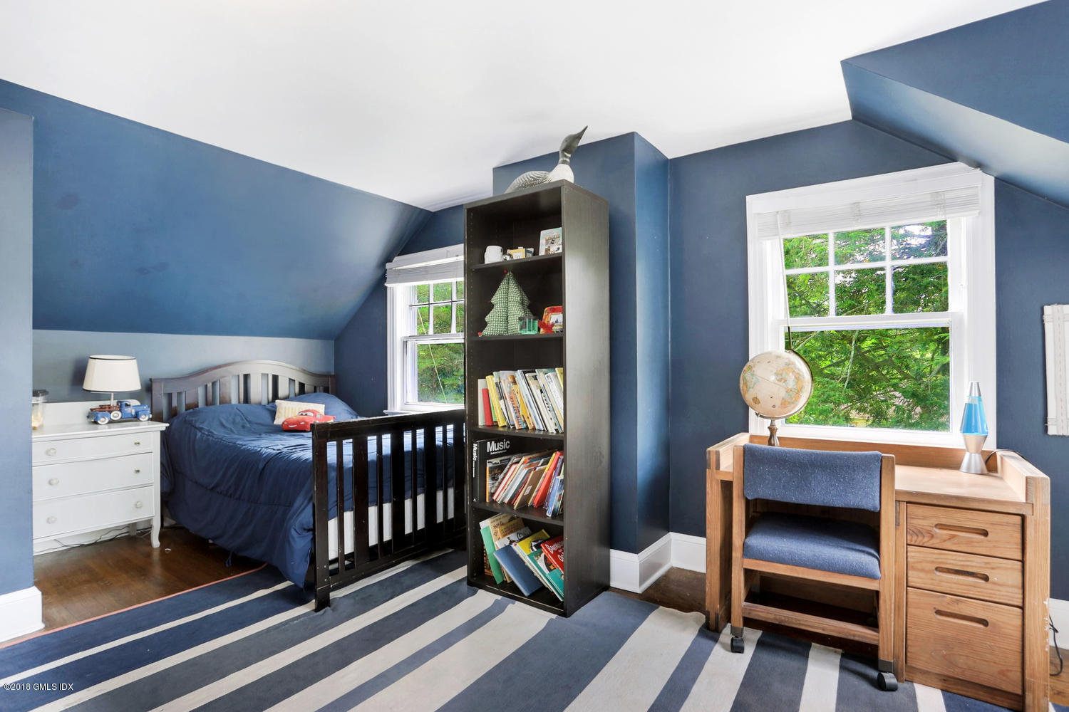 167 Riverbank Road Stamford, CT 06903 - Photo 22 of 38 a bedroom with furniture and a window