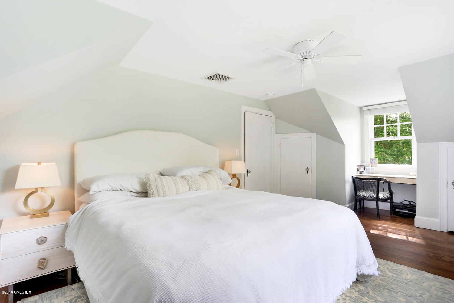 167 Riverbank Road Stamford, CT 06903 - Photo 24 of 38 a bedroom with a bed and a table