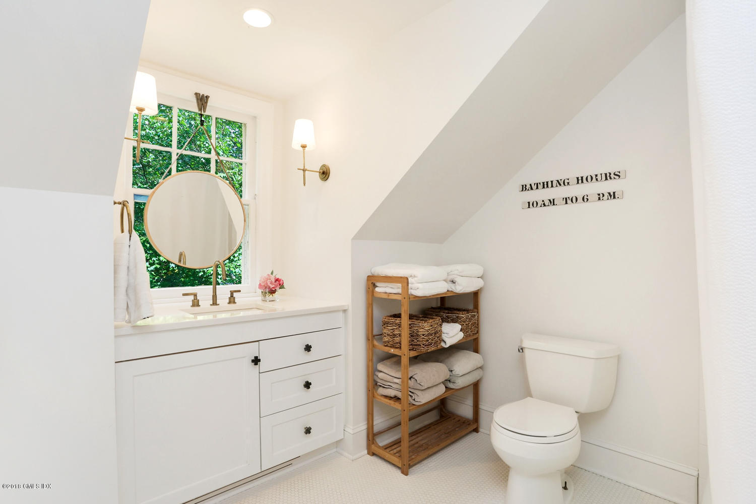 167 Riverbank Road Stamford, CT 06903 - Photo 25 of 38 a bathroom with a toilet sink and mirror