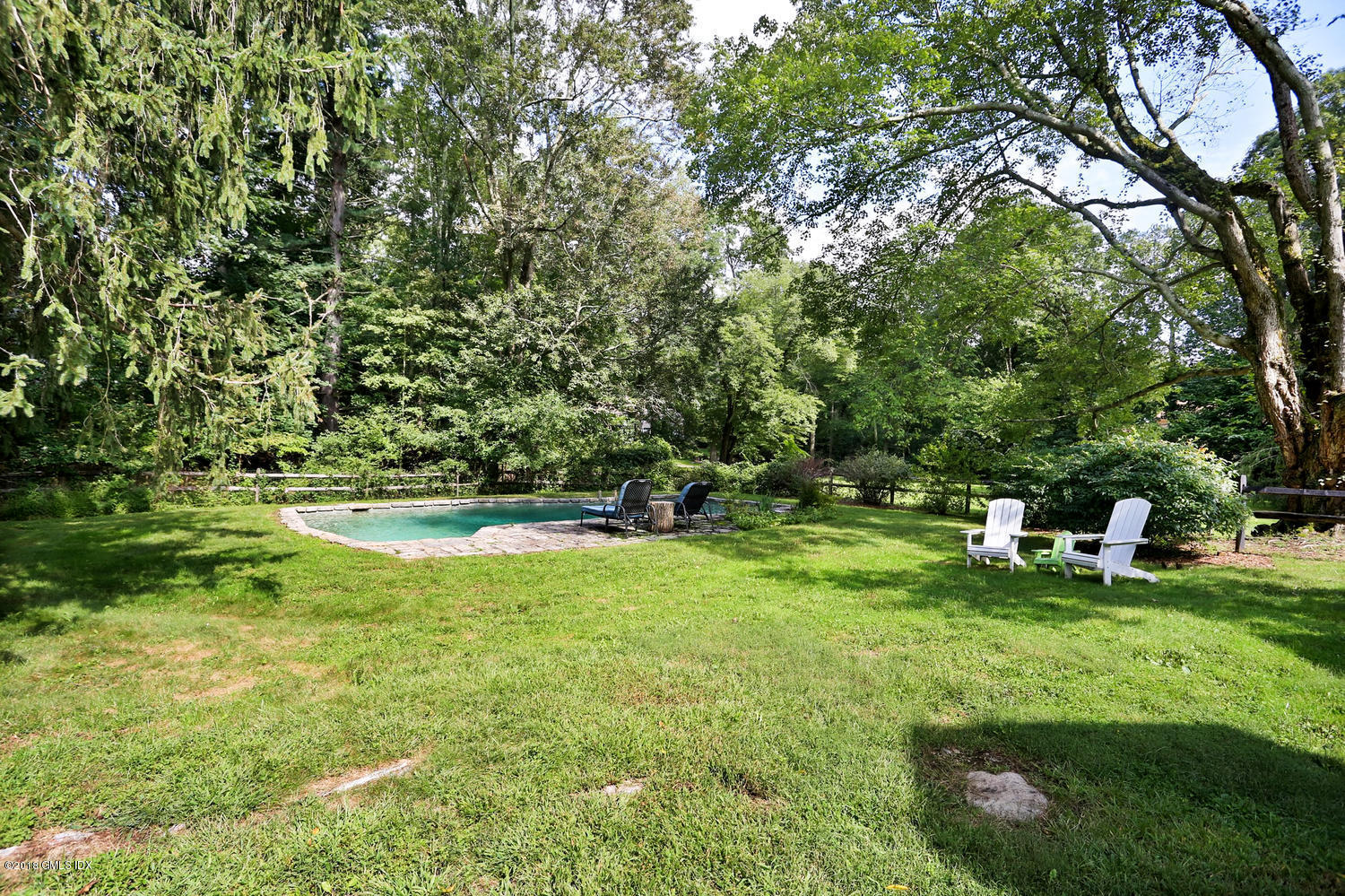 167 Riverbank Road Stamford, CT 06903 - Photo 31 of 38 a view of a park with large trees