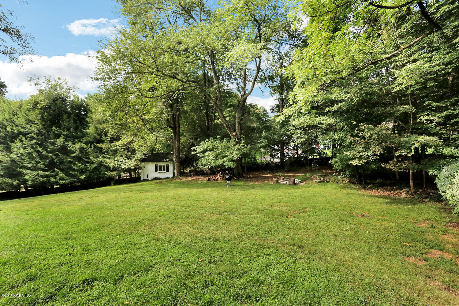 167 Riverbank Road Stamford, CT 06903 - Photo 38 of 38 a view of a field with a tree