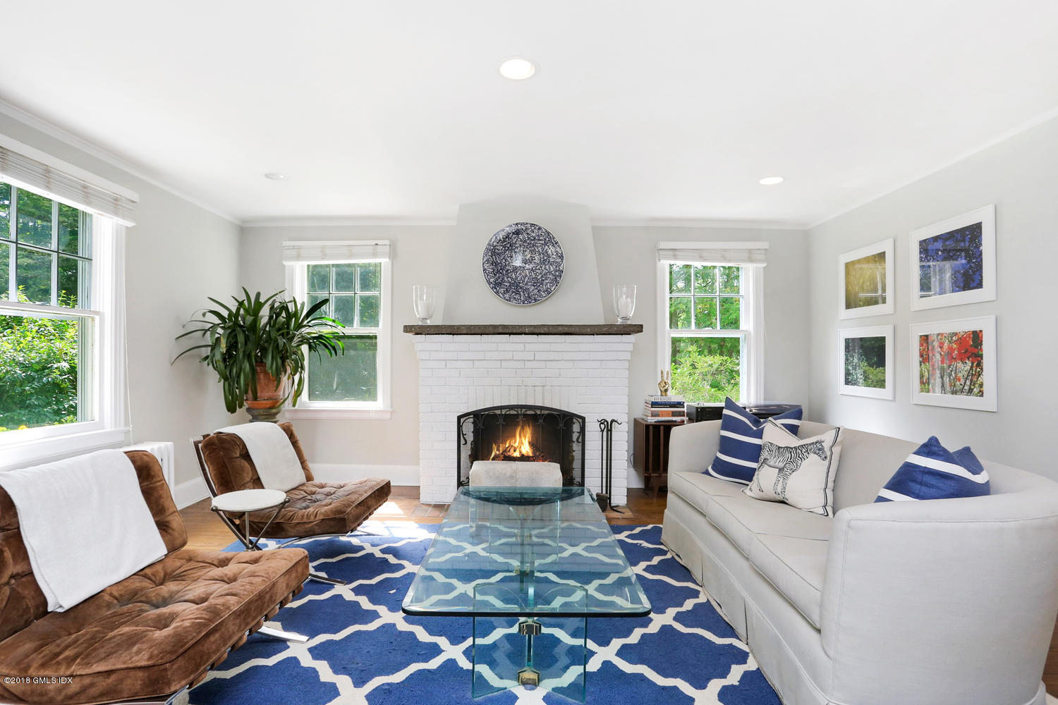 167 Riverbank Road Stamford, CT 06903 - Photo 5 of 38 a living room with furniture and a fireplace