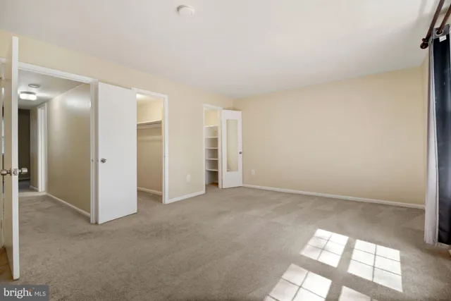 an empty room with windows