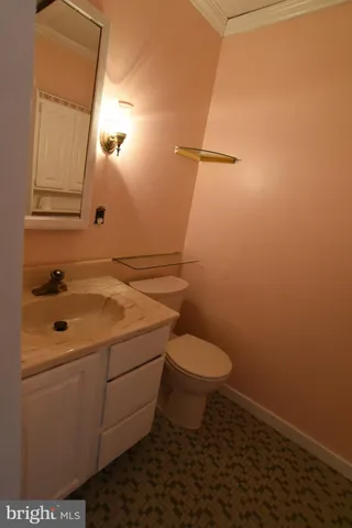 a bathroom with a sink toilet and mirror