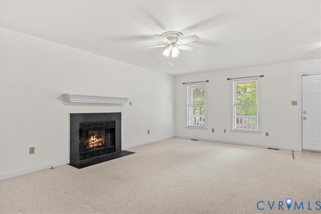 2924 Warfield Ridge Terrace Chester, VA 23831 - Photo 14 of 38 Living area featuring a fireplace with a black sur