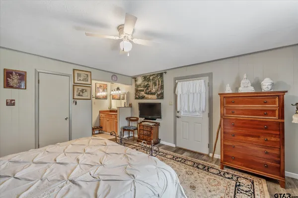 a bedroom with a bed and furniture