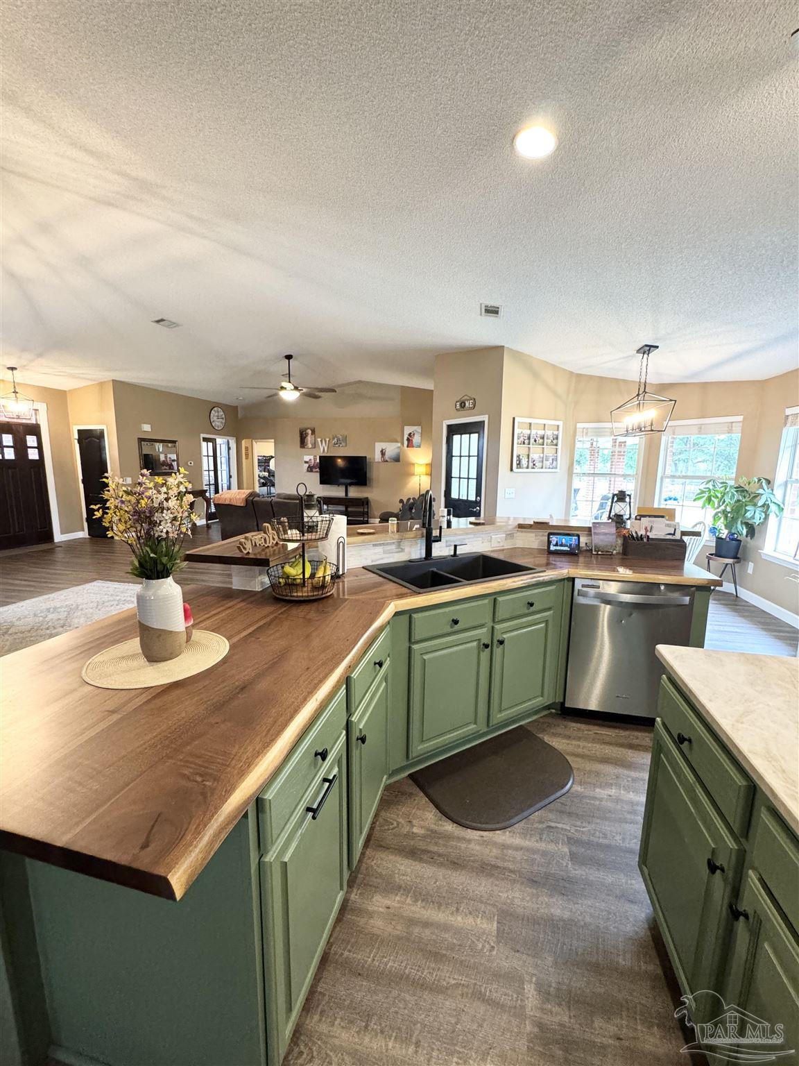 9909 South Trace Road Milton, FL 32583 - Photo 11 of 41 a kitchen with lots of counter top space and kitchen view