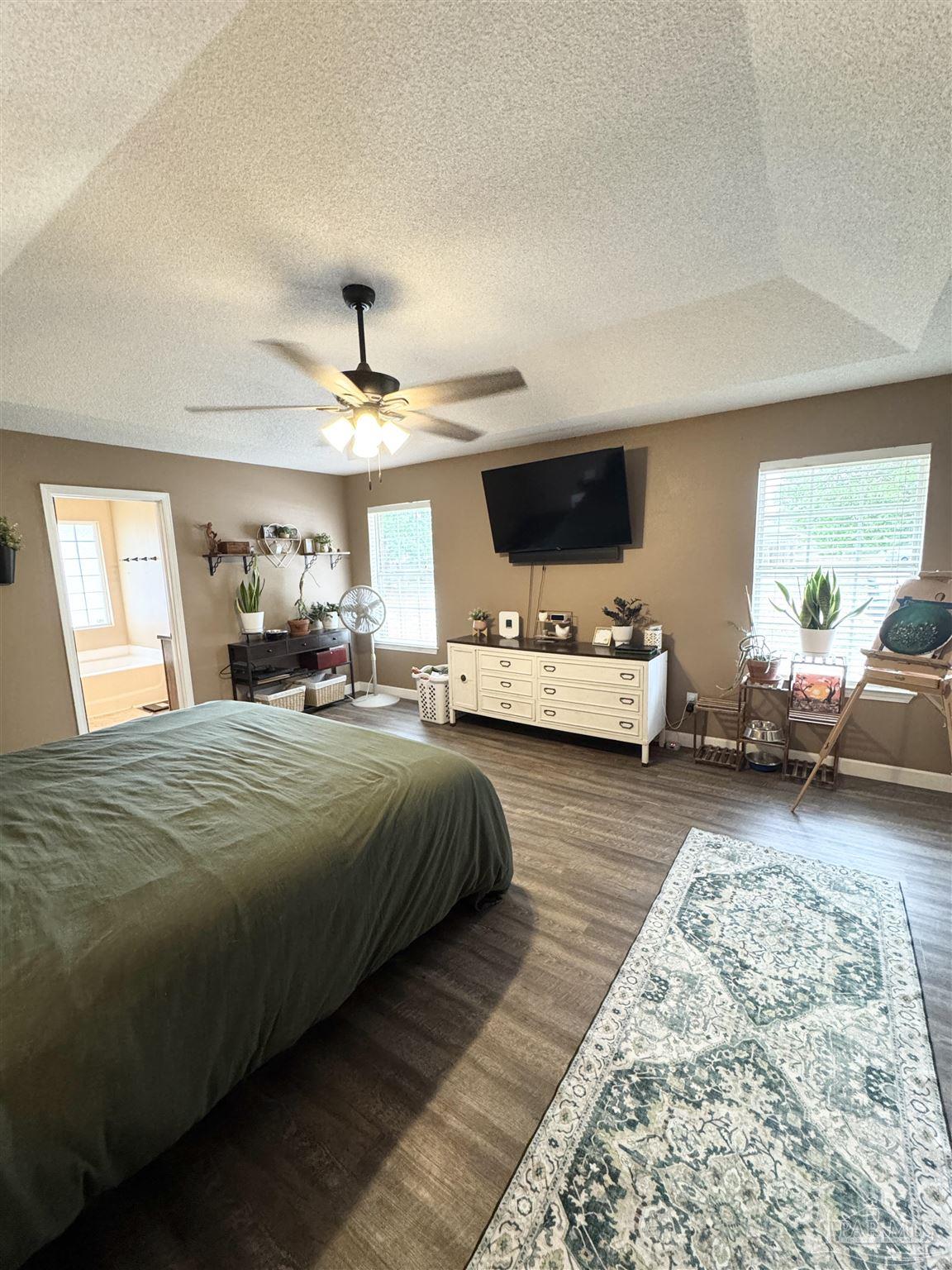 9909 South Trace Road Milton, FL 32583 - Photo 18 of 41 a bedroom with bed and window