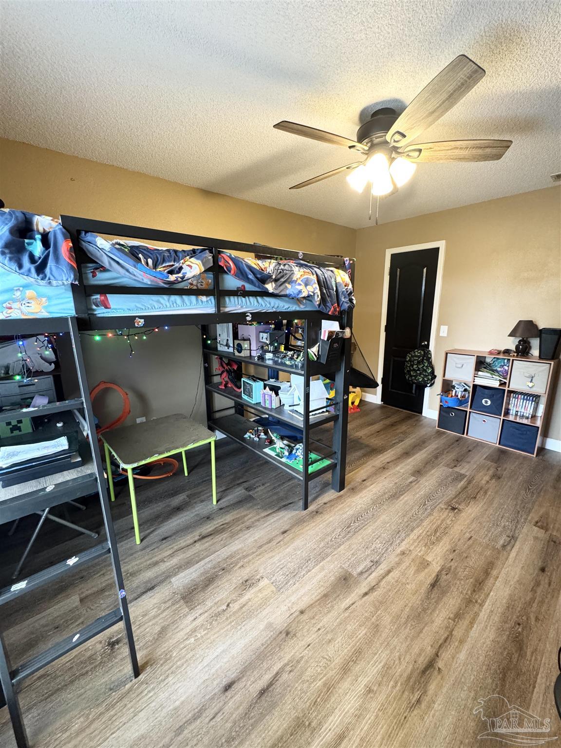 9909 South Trace Road Milton, FL 32583 - Photo 26 of 41 a view of a room with wooden floor table tennis pool table and chairs