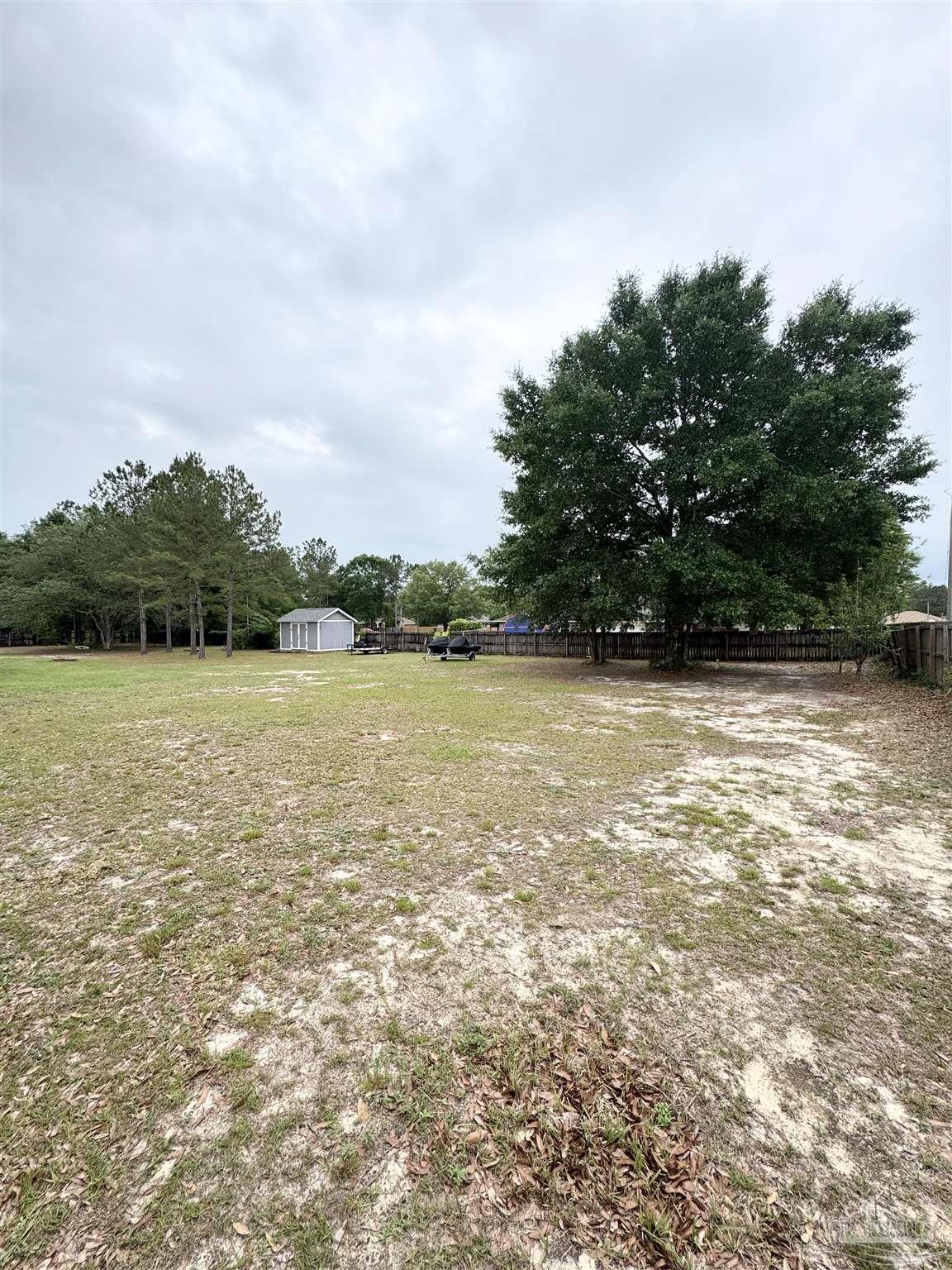 9909 South Trace Road Milton, FL 32583 - Photo 40 of 41 a view of a lake view