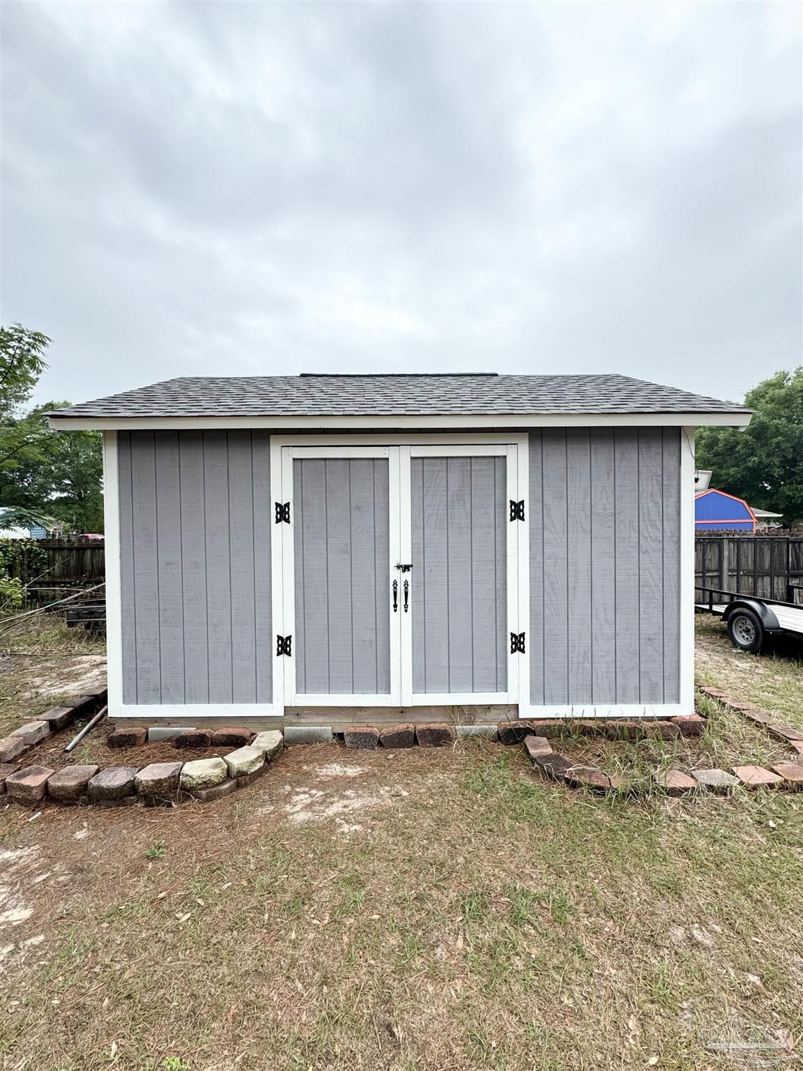 9909 South Trace Road Milton, FL 32583 - Photo 41 of 41 a house with a outdoor space