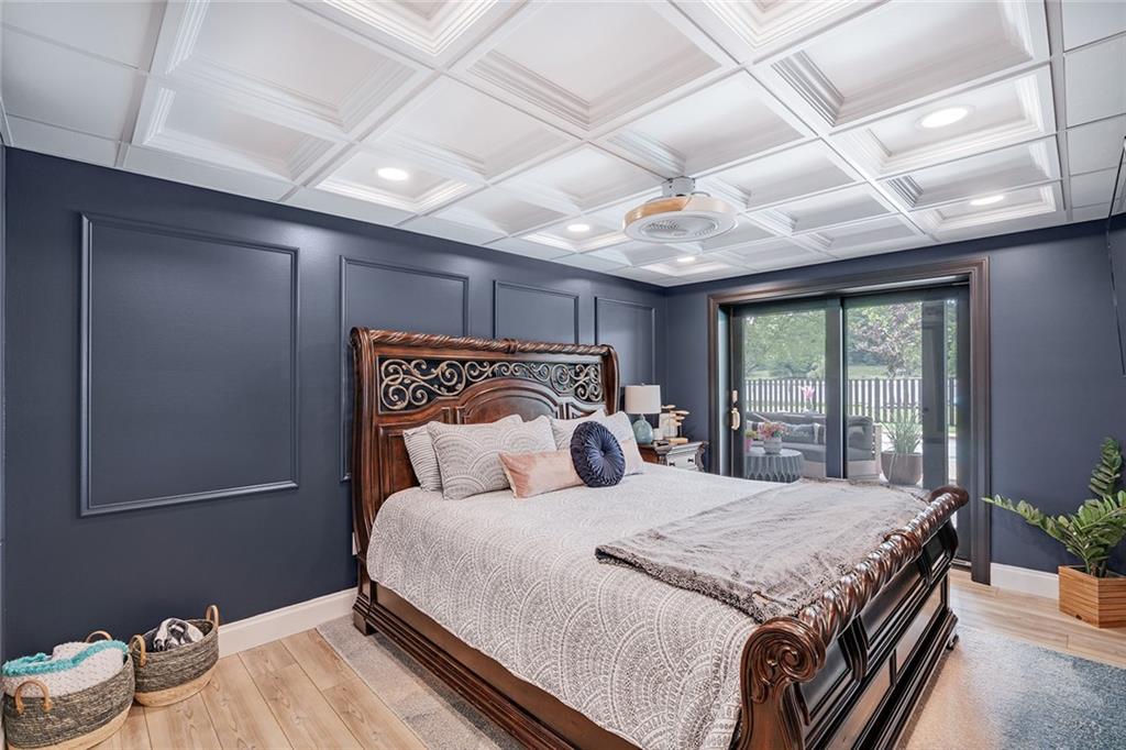 13399 Treasure Lake Road Du Bois, PA 15801 - Photo 36 of 49 a bedroom with a large bed and a chandelier
