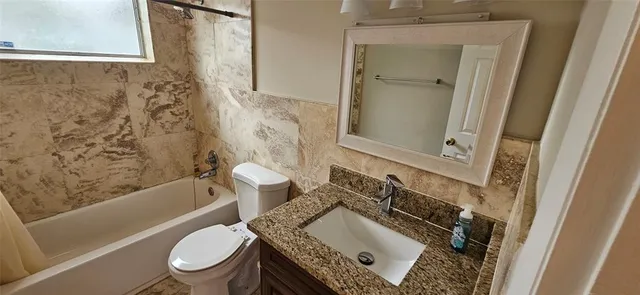 a view of a hallway with a window