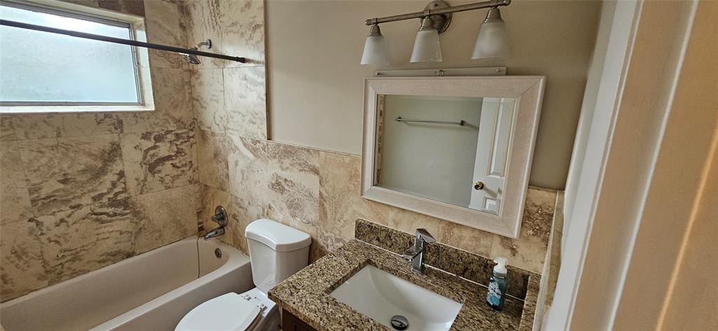 501 Northwest 65th Avenue Margate, FL 33063 - Photo 14 of 29 a bathroom with a sink a toilet and bathtub