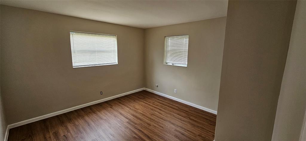 501 Northwest 65th Avenue Margate, FL 33063 - Photo 18 of 29 an empty room with wooden floor and windows