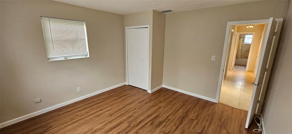 501 Northwest 65th Avenue Margate, FL 33063 - Photo 19 of 29 an empty room with wooden floor and windows