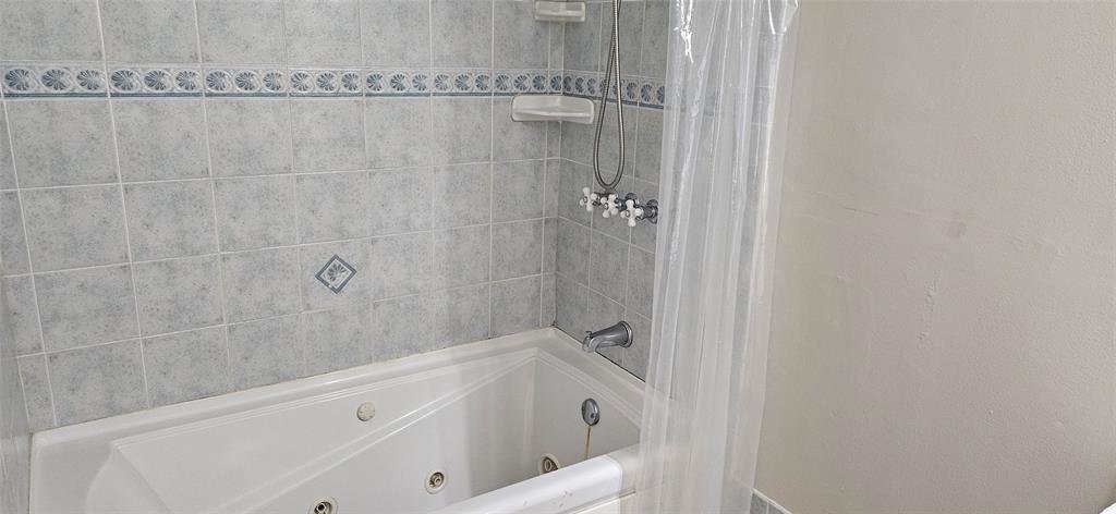 501 Northwest 65th Avenue Margate, FL 33063 - Photo 21 of 29 a bathroom with a bathtub and a shower