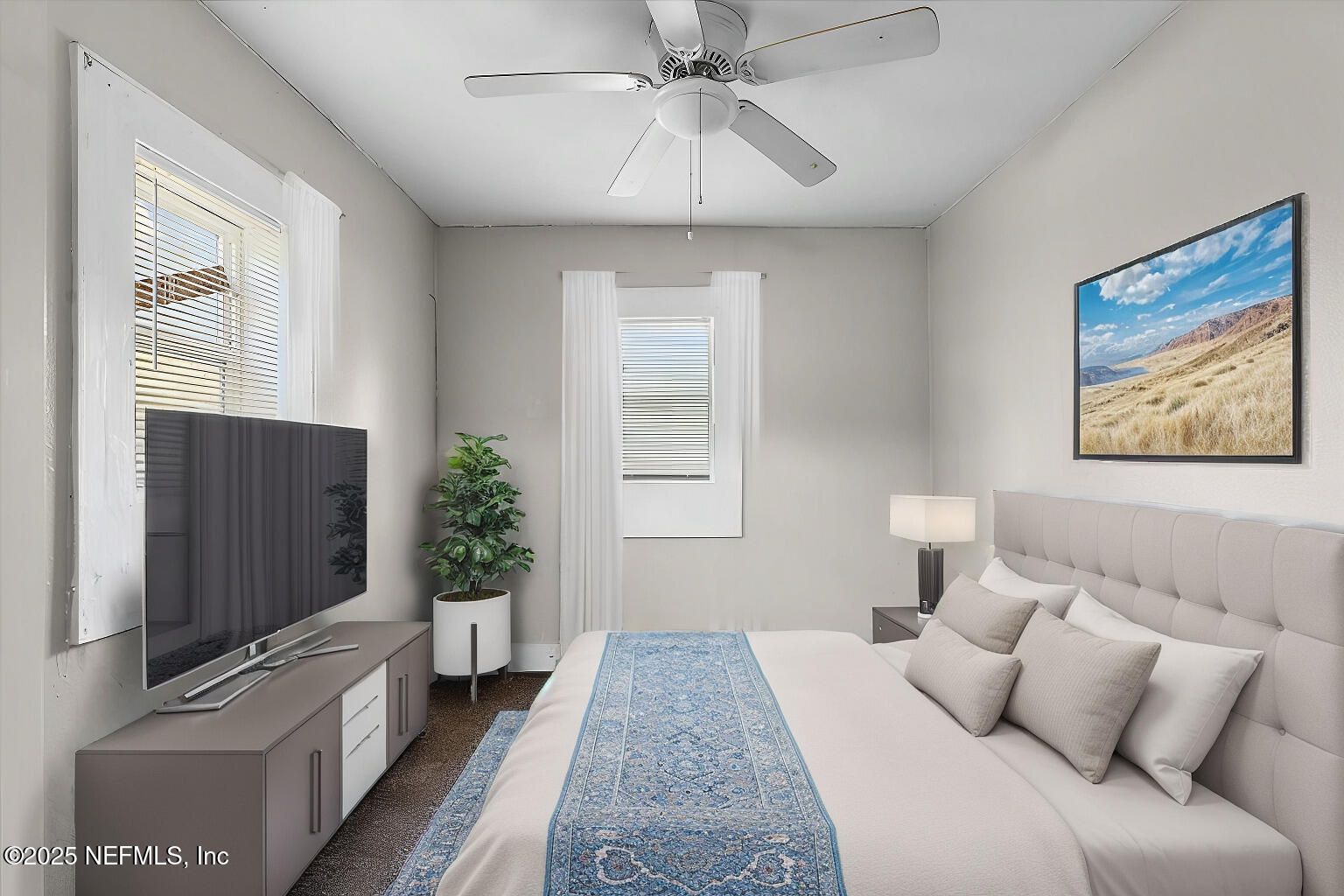 3607 Gilmore Street Jacksonville, FL 32205 - Photo 8 of 13 a bedroom with a bed and a flat screen tv