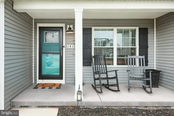 a view of house with outdoor seating space