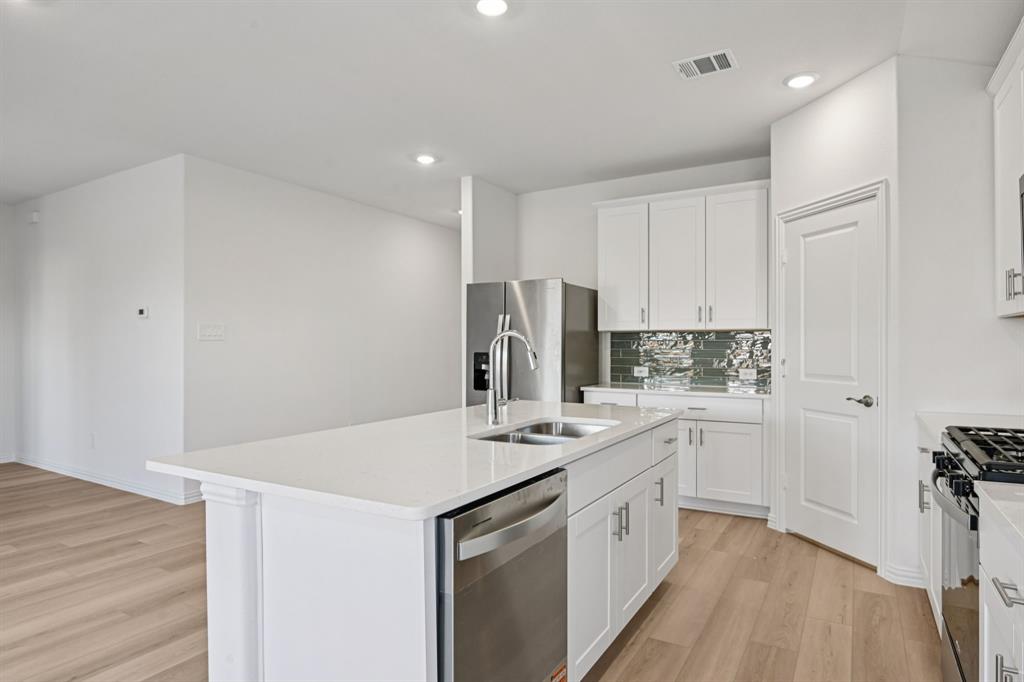 2231 Rannoch Street Sherman, TX 75092 - Photo 6 of 37 Photo is not of the actual home, but is an inspirational photo of builder’s model home and may depict options, furnishings, and/or decorator features that are not included.