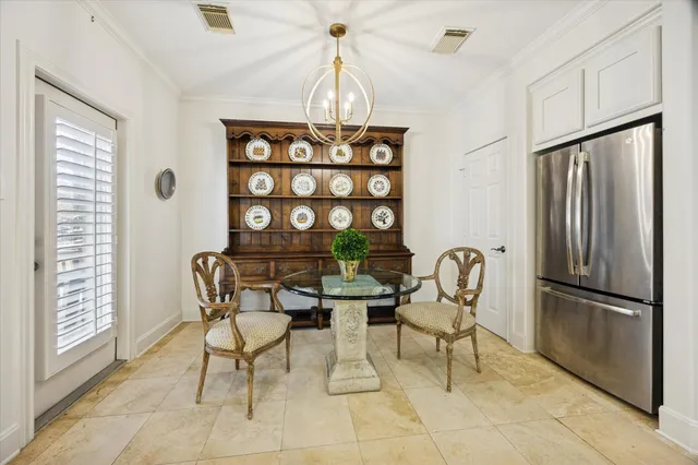 a balcony with wooden floor table and chairs