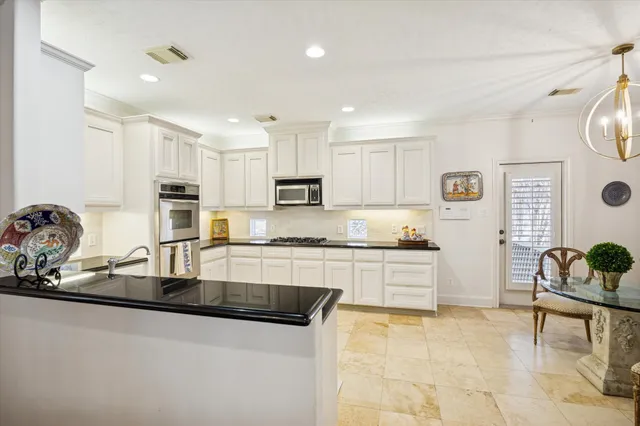 a bedroom with a large bed and a flat screen tv