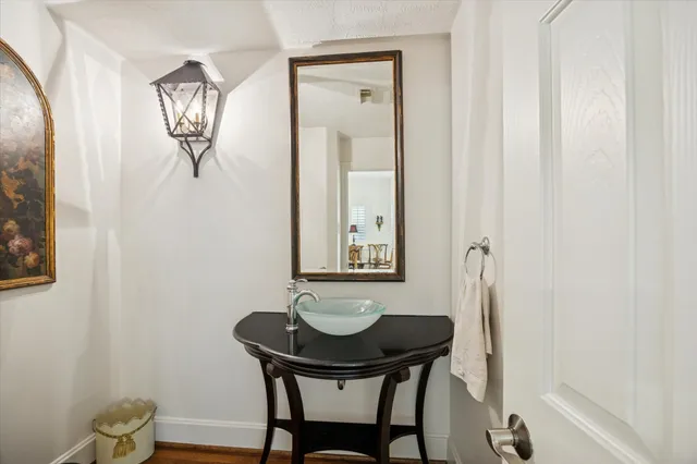 a spacious bathroom with a double vanity sink a large mirror a shower and a bathtub