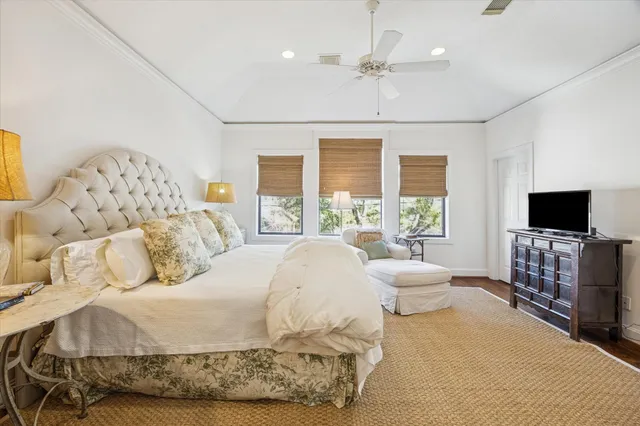 a view of a hallway with furniture and windows